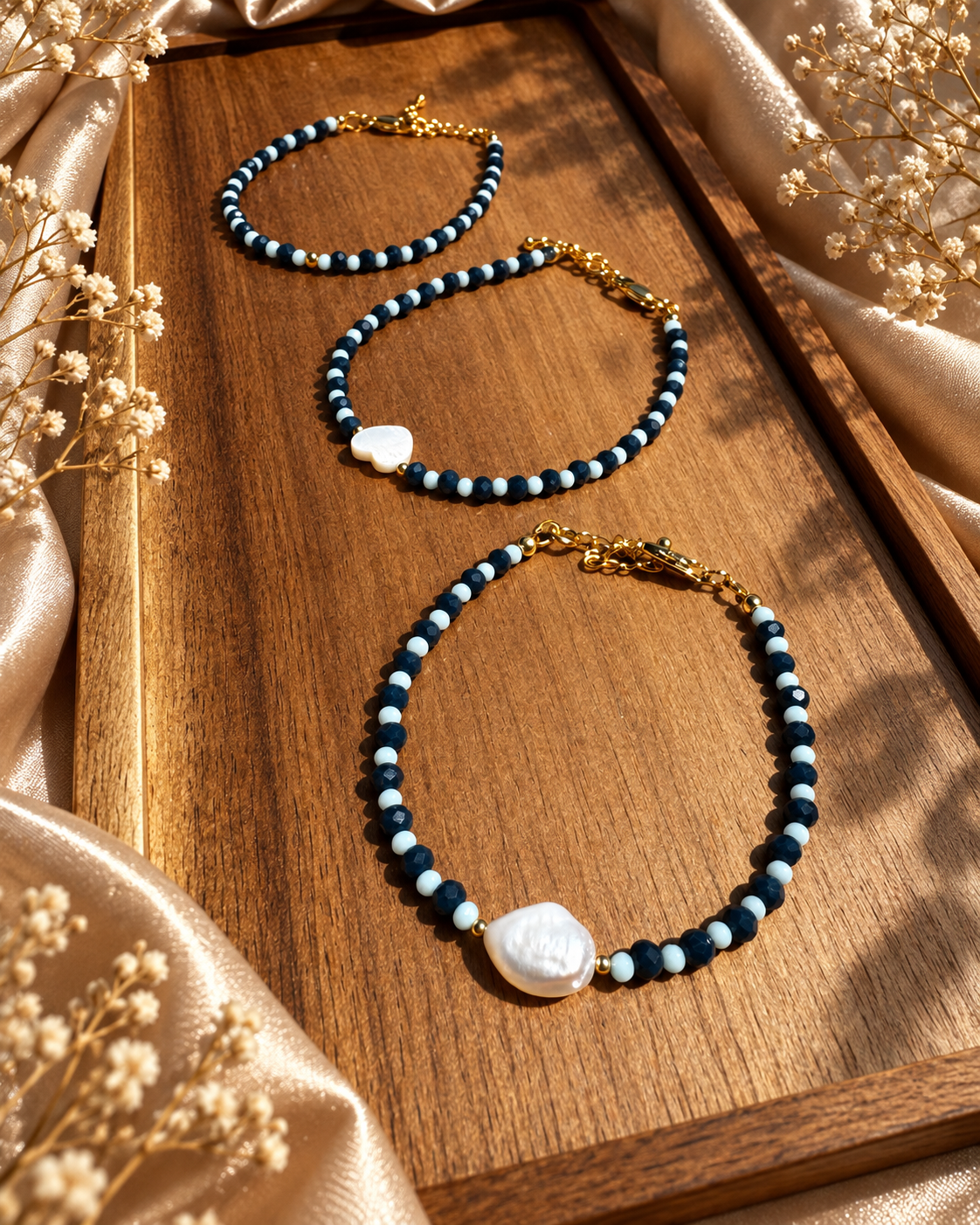 Blue glass bracelets with pearl and shell accents